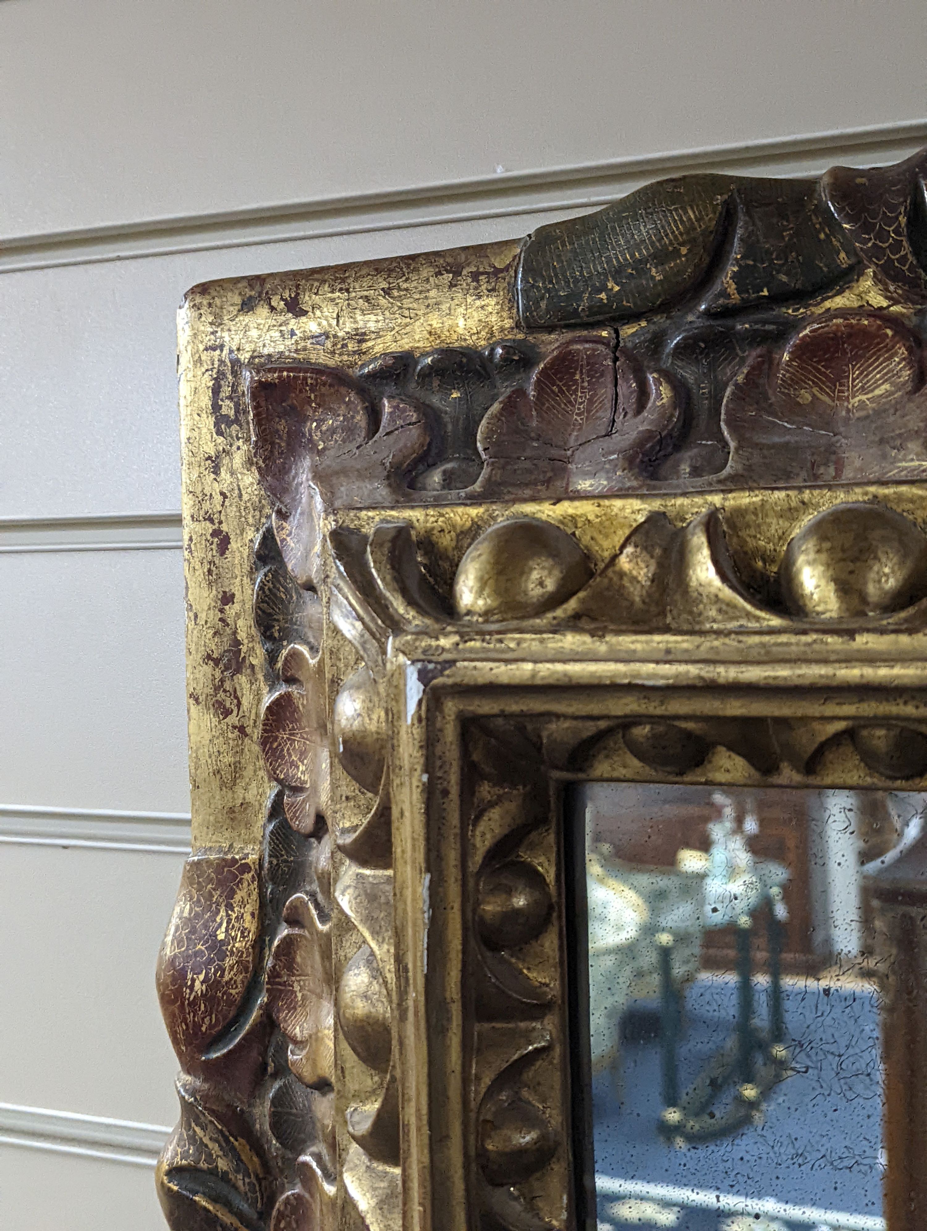 An 18th century painted Italian carved giltwood rectangular wall mirror, width 50cm, height 63cm